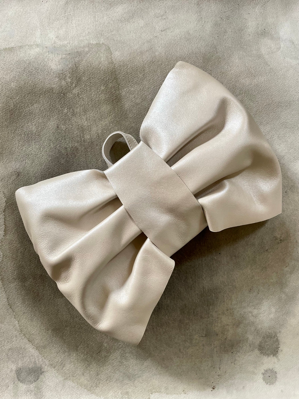 Donsje Pearlized Leather "Bow" Backpack